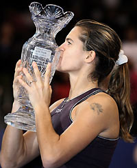 melie Mauresmo of France poses with the trophy after defeating compatriot Mary Pierce during the final of the WTA Tour Championships in Los Angeles November 13, 2005.