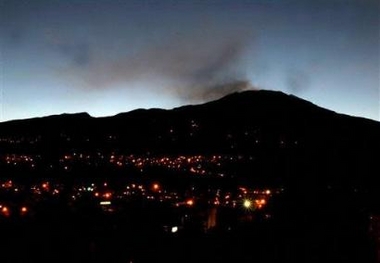 The Galeras volcano spews smoke and ash in Pasto, Colombia, 330 miles southwest of Bogota, Thursday, Nov. 24, 2005.