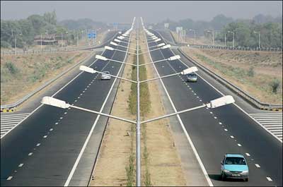 The new national highway in Rajasthan State, India. The revamped highways are feeding a new appetitie for fast cars. 