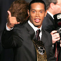 Ronaldinho of Brazil holds his trophy during the FIFA World Player 2005 awards ceremony in Zurich, Switzerland, December 19, 2005.