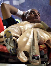 Adriano is carried off the pitch after being injured during a Serie A soccer match against Empoli at the San Siro stadium in Milan December 21, 2005.