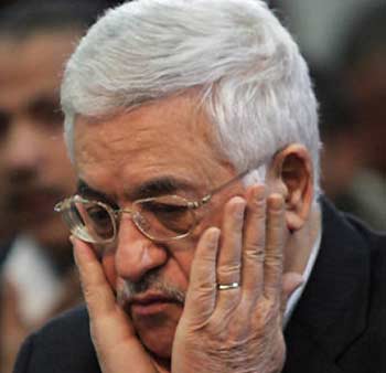 Palestinian President Mahmoud Abbas attends Friday prayers in the West Bank city of Ramallah on December 16, 2005. 