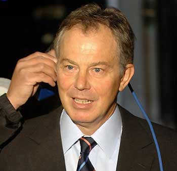 Britain's Prime Minister Tony Blair is prepared before giving an interview about his flagship "Respect Action Plan" at Downing Street in London January 10, 2006. British police could be given powers to evict nuisance neighbours from their homes and problem parents will get lessons on raising children under a new government drive to crack down on anti-social behaviour. The "Respect Action Plan", unveiled by Blair on Tuesday, will also increase on-the-spot fines for yobs and give communities a bigger say over policing.