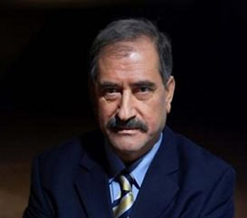 Iraqi judge Saeed al-Hammash, the second-ranking member of the five-judge tribunal trying former President Saddam Hussein, poses for a portrait, Sunday, Jan. 22, 2006, in Baghdad, Iraq.