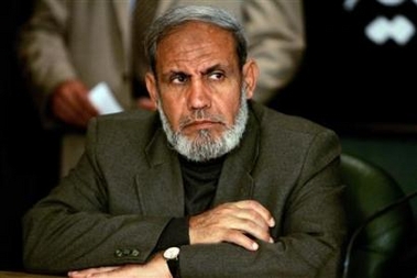 Senior Hamas leader Mahmoud al-Zahar listens during a news conference in Cairo, February 8, 2006.