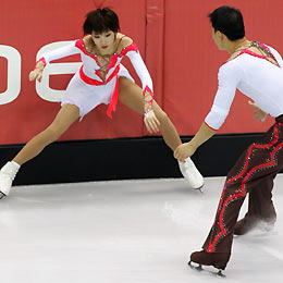 Zhang Hao 
 (R) looks at Zhang Dan from China after she fell during the figure skating Pairs Free Skating at the Torino 2006 Winter Olympic Games in Turin, Italy, February 13, 2006. Zhang Hao and Zhang Dan won the Silver Medal. 