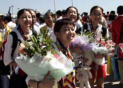 Chinese athletes return home