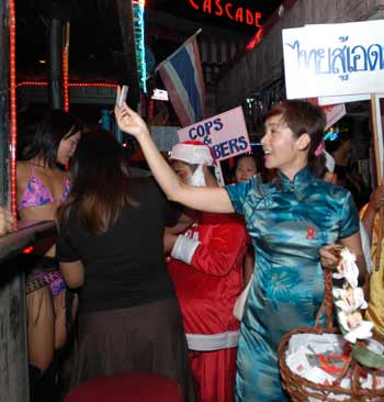 Chinese stars hand out condoms in Thai red light area