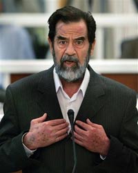Saddam pleads innocent, gets into scuffle