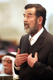 Saddam storms out of court