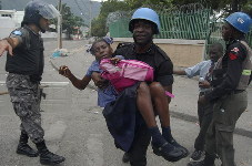 Student protestors in Haiti burn UN police car