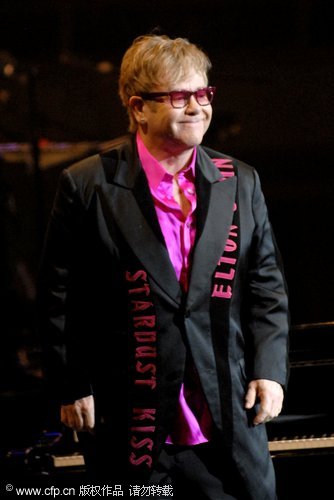 Elton John performing with old friend