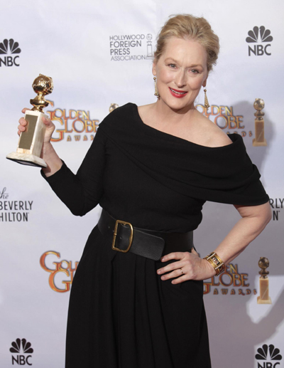 Meryl Streep holds her award for 