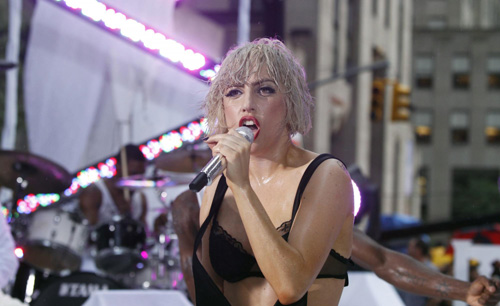 Lady Gaga performs during a rain shower on NBC's 