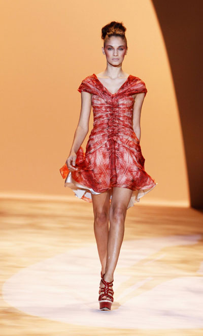 Models present creations from the Christian Siriano Spring 2011 collection during New York Fashion Week