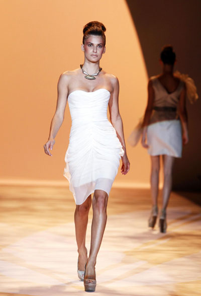 Models present creations from the Christian Siriano Spring 2011 collection during New York Fashion Week