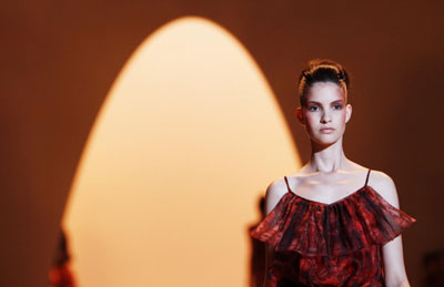 Models present creations from the Christian Siriano Spring 2011 collection during New York Fashion Week