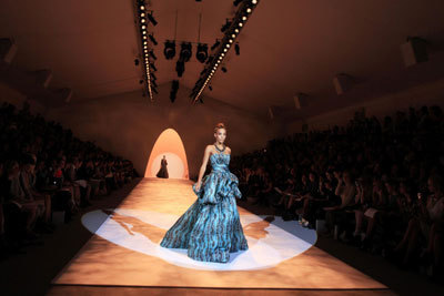 Models present creations from the Christian Siriano Spring 2011 collection during New York Fashion Week