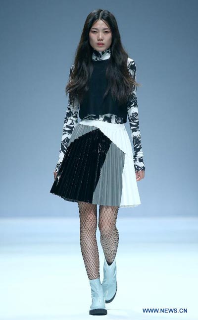 Models present creations by Italian designer at China Fashion Week