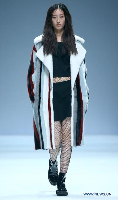 Models present creations by Italian designer at China Fashion Week