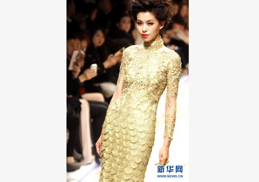 Models present Guo Pei's creations at Shanghai fashion week