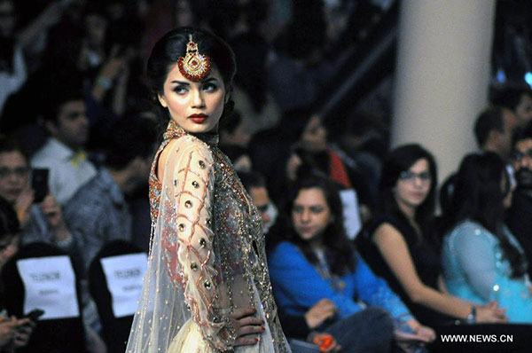 Models present creations at Bridal Couture Fashion Week