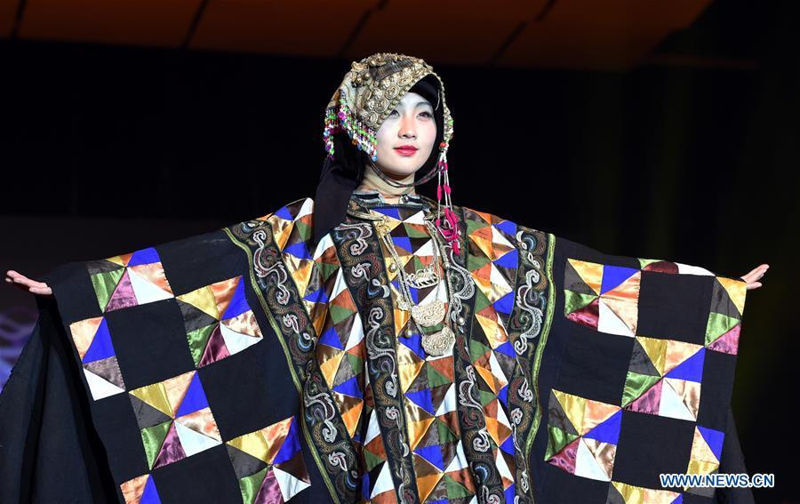 Models present costumes of ethnic groups in Yunnan