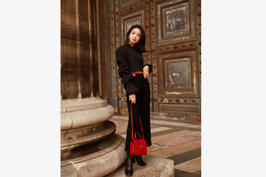 Song Qian poses for street style photos