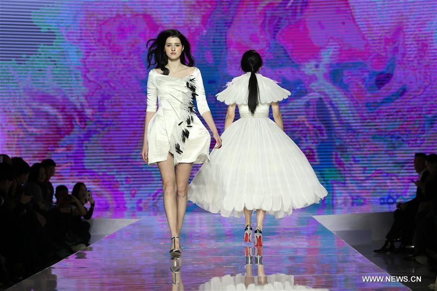 Models display Grace Chen's creations in Beijing