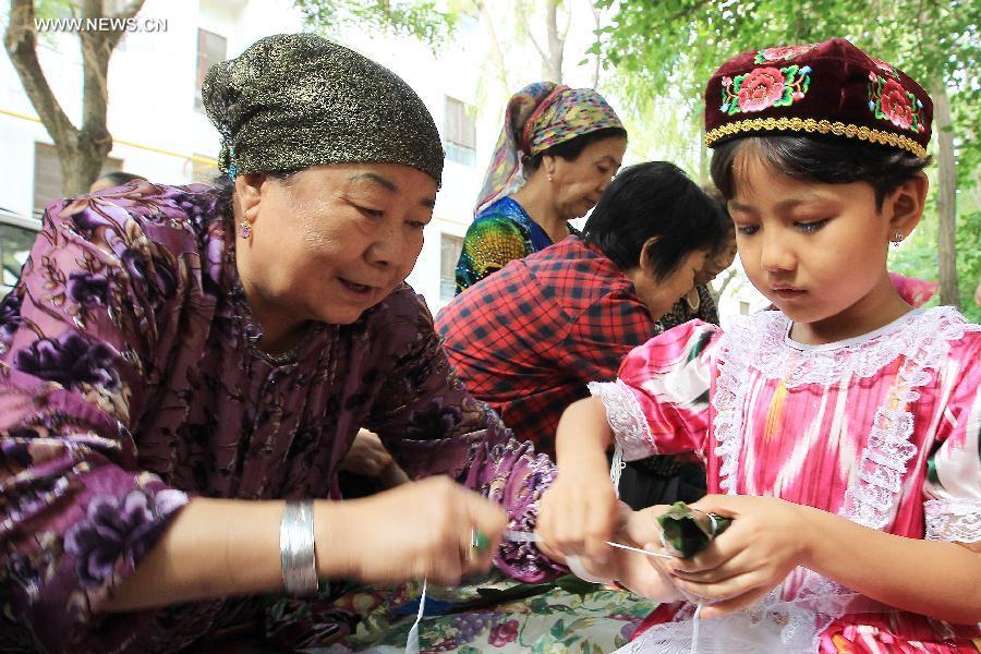 Chinese wrap up Zongzi to mark upcoming Dragon Boat Festival