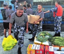 Typhoons and surging tides fail to dampen sailors' spirits
