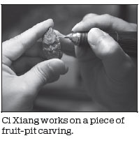 Fruit-pit carver helps people with disabilities
