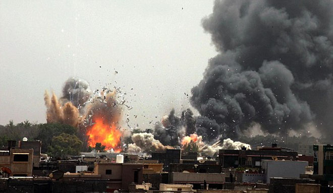 北约密集轰炸利比亚 卡扎菲誓言血战到底子女助阵