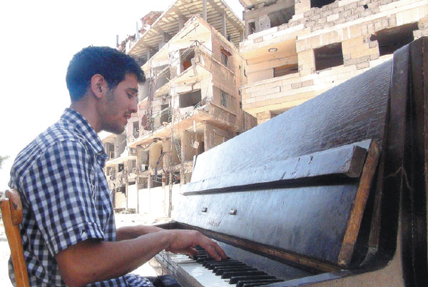 In Syria's starving Yarmuk camp, a pianist conjures hope