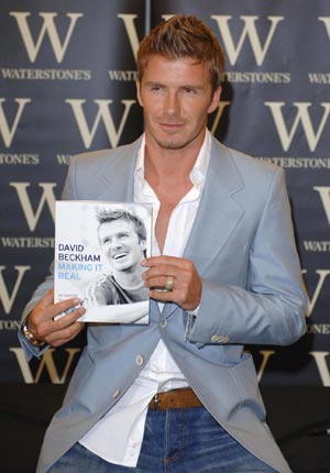 David Beckham signs copies of his new autobiography 'making it real'