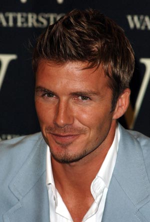 David Beckham signs copies of his new autobiography 'making it real'