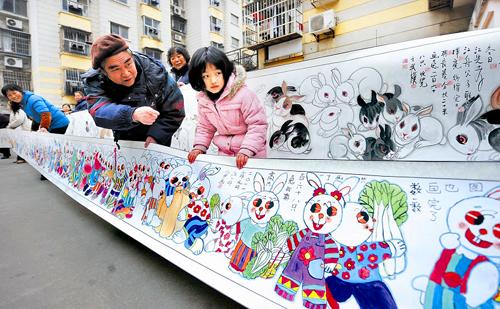 Folk Painter draws long scroll of rabbit to greet Chinese New Year