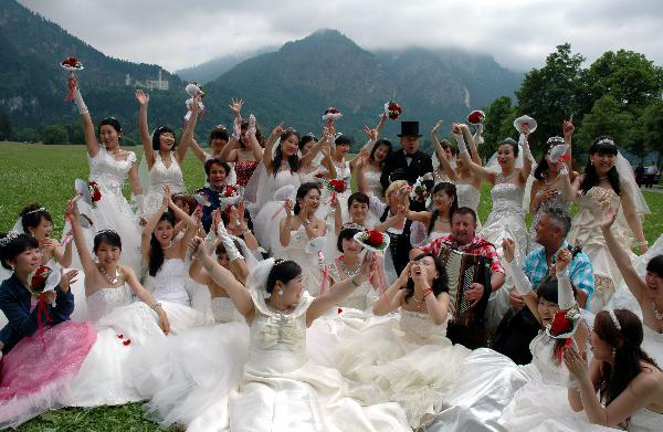 Collective wedding held at New Swan Stone Castle in Fuessen, Germany