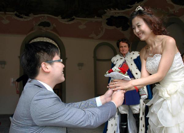 Collective wedding held at New Swan Stone Castle in Fuessen, Germany