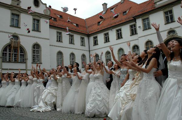 Collective wedding held at New Swan Stone Castle in Fuessen, Germany