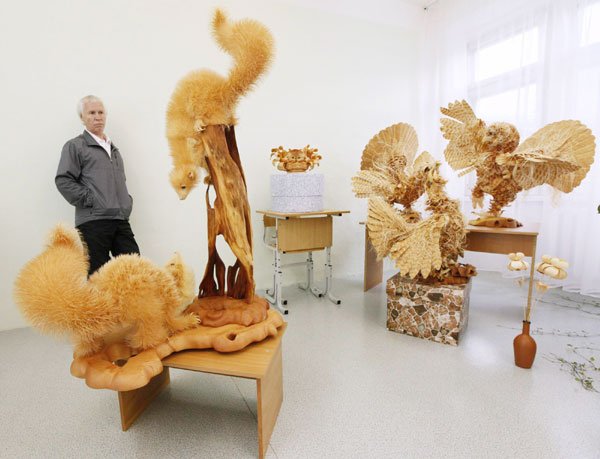 A life-sized owl sculpture made from cutting chips