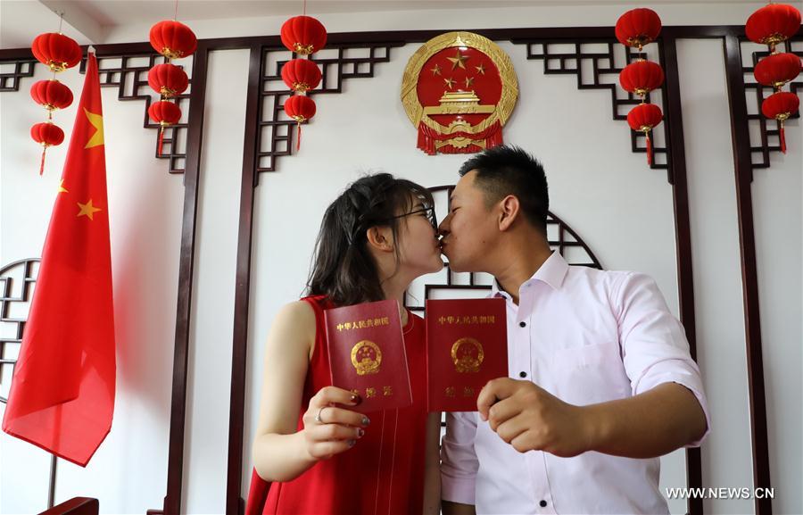 Look of love: Many Chinese couples get married on May 20