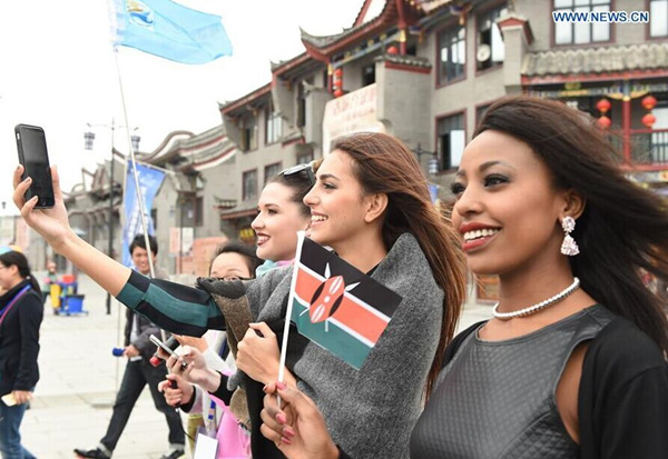 Finalists of Miss World take selfies in SE China