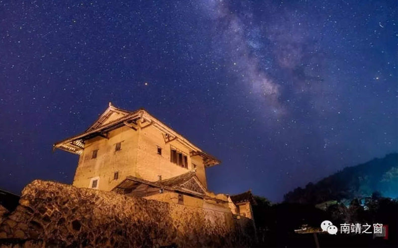 Beautiful starry skies above earthen buildings