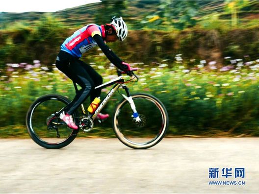 Mountain bikers race through lush landscape in Zhuanglang