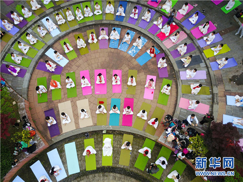 Locals practice yoga for health in Guiyang