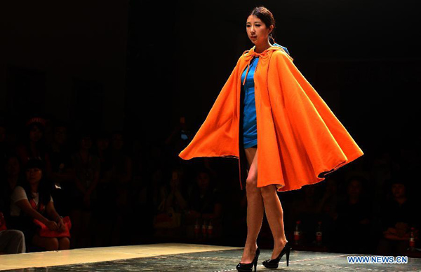 Models present creations of graduates of School of Fashion in Wuhan