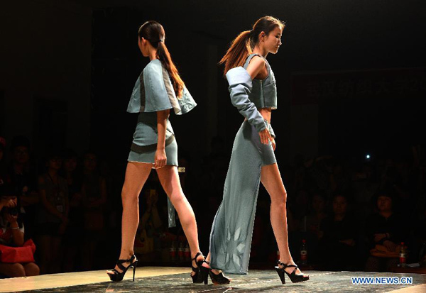 Models present creations of graduates of School of Fashion in Wuhan