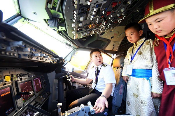 Mongolian teenagers visit Boeing airplane