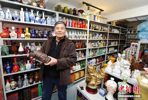 Elderly NE China man has a fascination with wine bottles